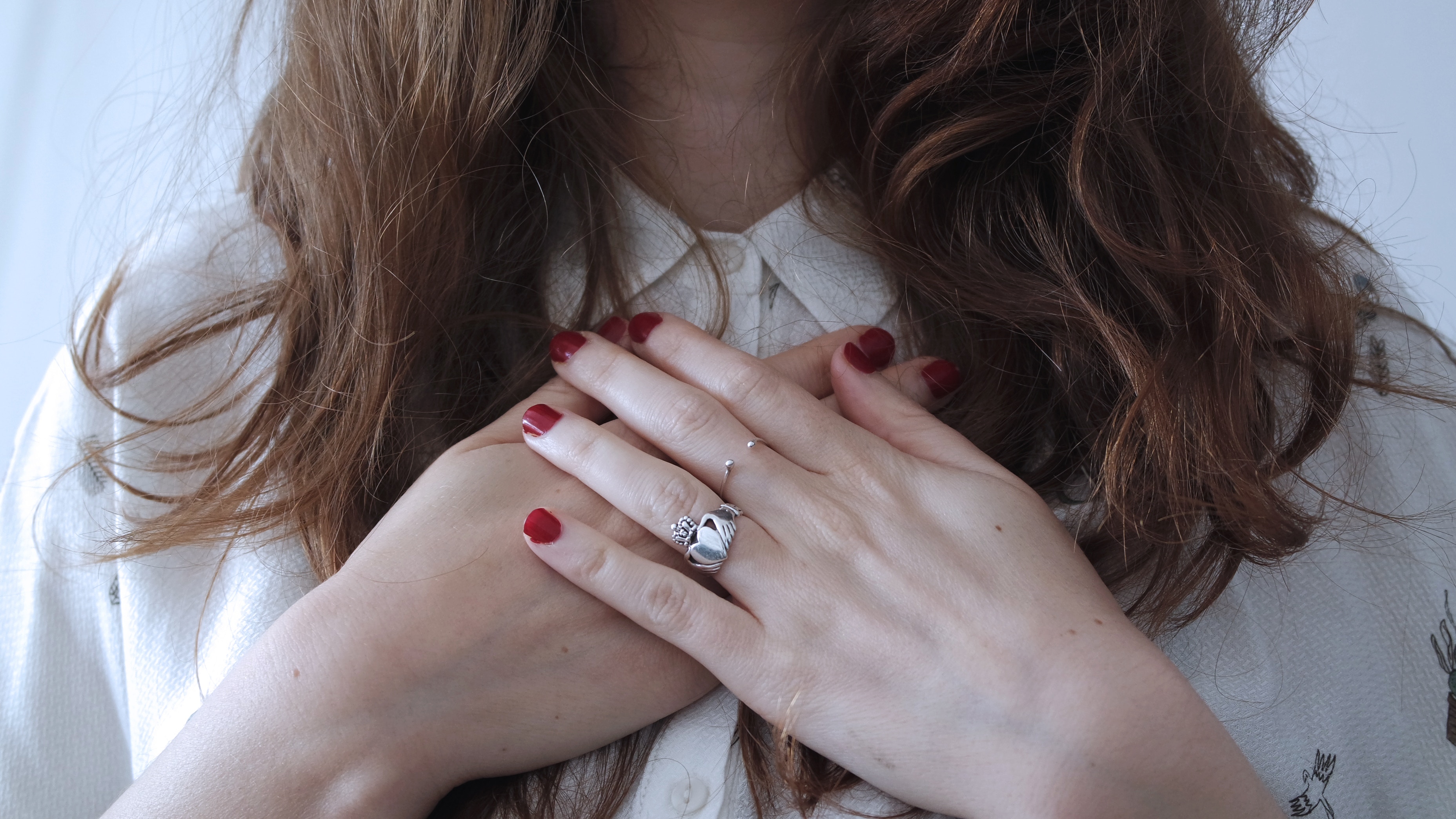 alt=woman covering chest, alt=open heart